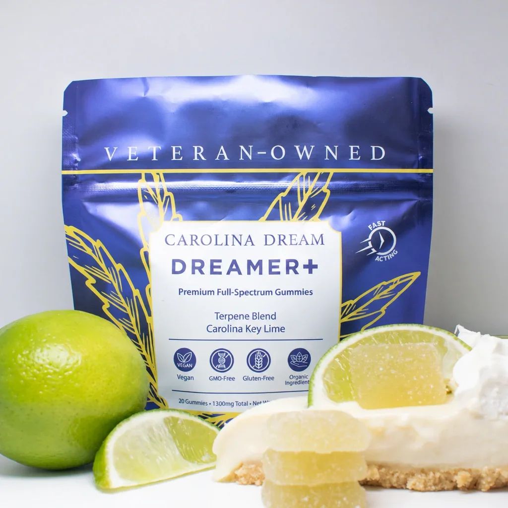 A pouch of Carolina Dream Dreamer+ gummies sits next to limes and a slice of pie.
