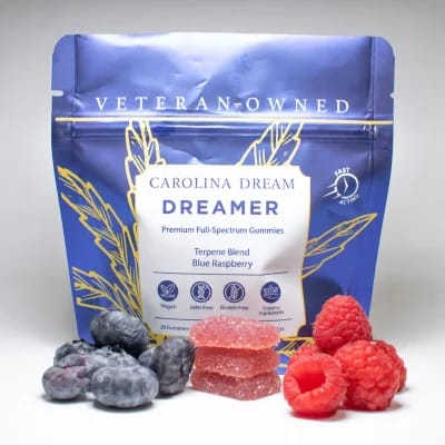 A blue pouch of Carolina Dream Dreamer gummies with blueberries and raspberries.
